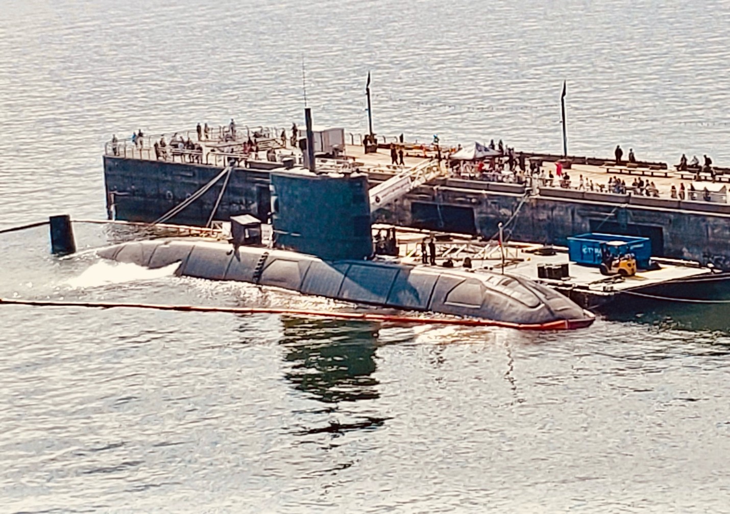 Photo of the submarine HMCS Cornerbrook, tied up at a pier in North Vancouver.