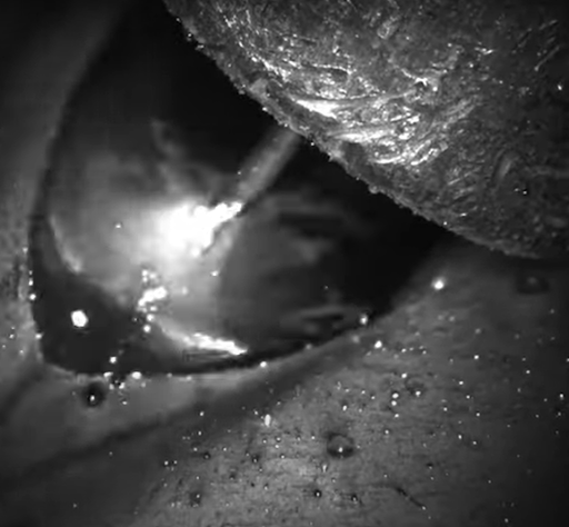 Close up black and white photo showing a weld